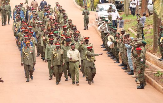 Retirees leaving the MoDVA HQ in Mbuya, waving as a symbol of their departure from active service.