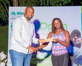 Hima Cement’s Head of Sales, Israel Tinkasiimire, presents an award to one of the players during the event.