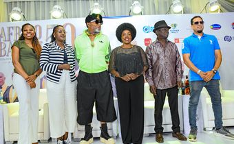 Kofi Olomide with Afrigo Band members at the press conference