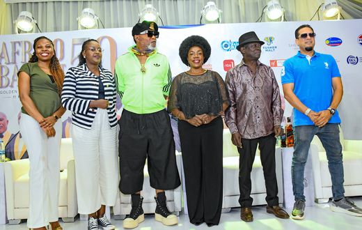 Kofi Olomide with Afrigo Band members at the press conference