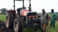 Chair Person Of Gukwatamanzi Farmers Cooperative Society In Bokwe , Masindi Showing Off The Tractor  The Group Got Through Adc Linkages.
