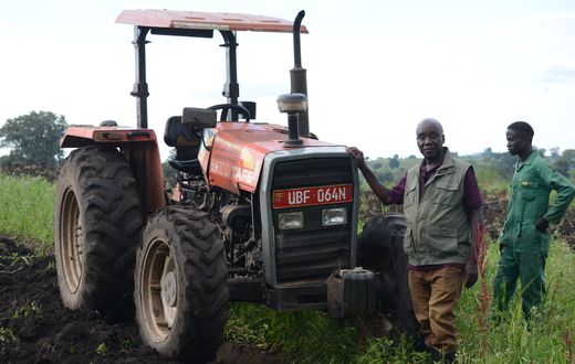 Chair Person Of Gukwatamanzi Farmers Cooperative Society In Bokwe , Masindi Showing Off The Tractor  The Group Got Through Adc Linkages.