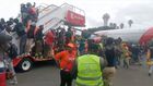Supporters gathered to receive the body of former Prime Minister Raila Odinga breached security barriers and flooded the runway. 
