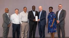 Vivo Energy Group CEO Stan Mittelman (3R), presents the Vivo Award to the Uganda Team led by the MD, Joanita Mukasa Menya (2R) and the officials at the conference recently.