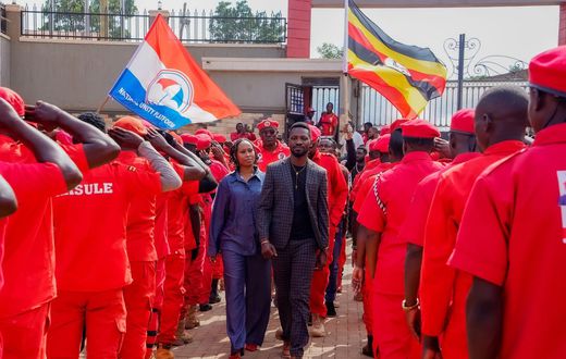 Bobi Wine touring a guard of honor