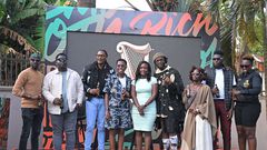 The influencers pose for a photo with Elizabeth Mutamuliza, Head of Beer at Uganda Breweries Limited (middle)