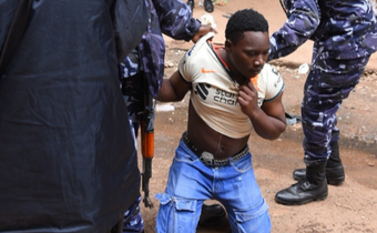 A trader being arrested. Image credit: NTV Uganda