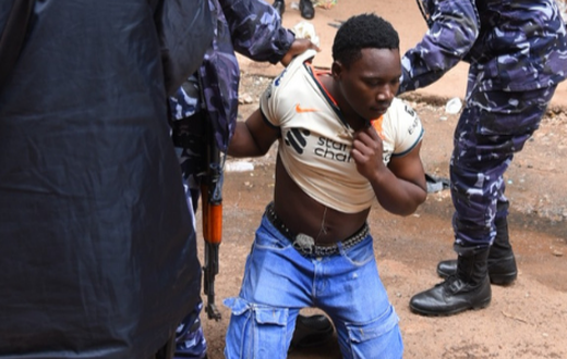 A trader being arrested. Image credit: NTV Uganda
