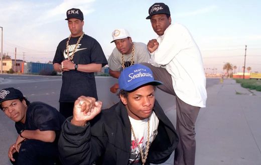 N.W.A, hip-hop’s street reporters, on March 23, 1989: Ice Cube, far left; Eazy-E, center; standing from left, DJ Yella, Dr. Dre and MC Ren. (Douglas R. Burrows / Los Angeles Times )