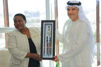 Nabbanja hands a gift to H.E. Rashed Alblooshi, Under-Secretary Abu Dhabi Department of Economic Development