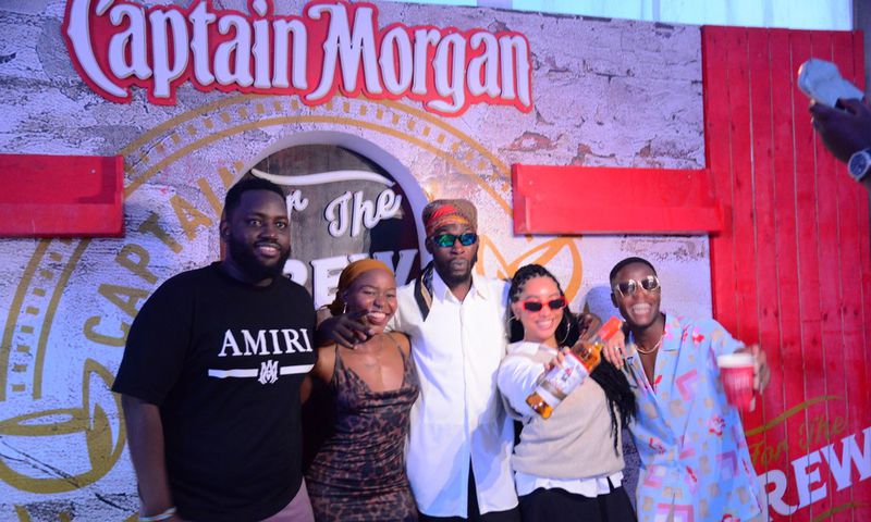 Kranium poses with fans upon arrival in Kampala
