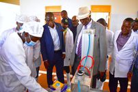 Minister Rwamirama is shown some of the milk products being processed by the Cooperative