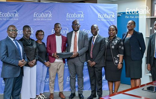 Ecobank Uganda’s Managing Director, Grace Muliisa poses with one of the winning enterprises
