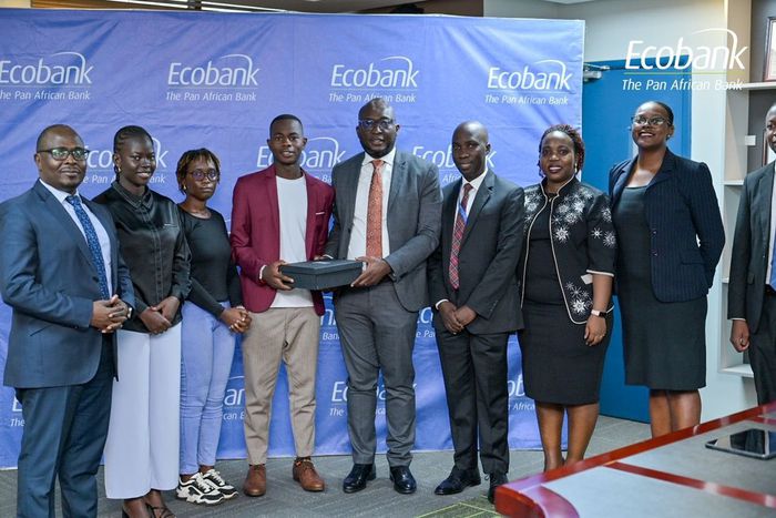 Ecobank Uganda’s Managing Director, Grace Muliisa poses with one of the winning enterprises