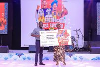 Susan Kyokusiima receiving the grand prize