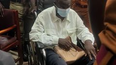 Dr Kizza Besigye arrived at the Nakawa Court in a wheelchair