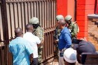 More photos from police raid on NUP properties