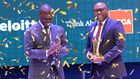 Peter Ssenyange, PostBank Uganda’s Chief Financial Officer, receiving the CFO of the Year from Assistant Auditor General, James Bantu (L)