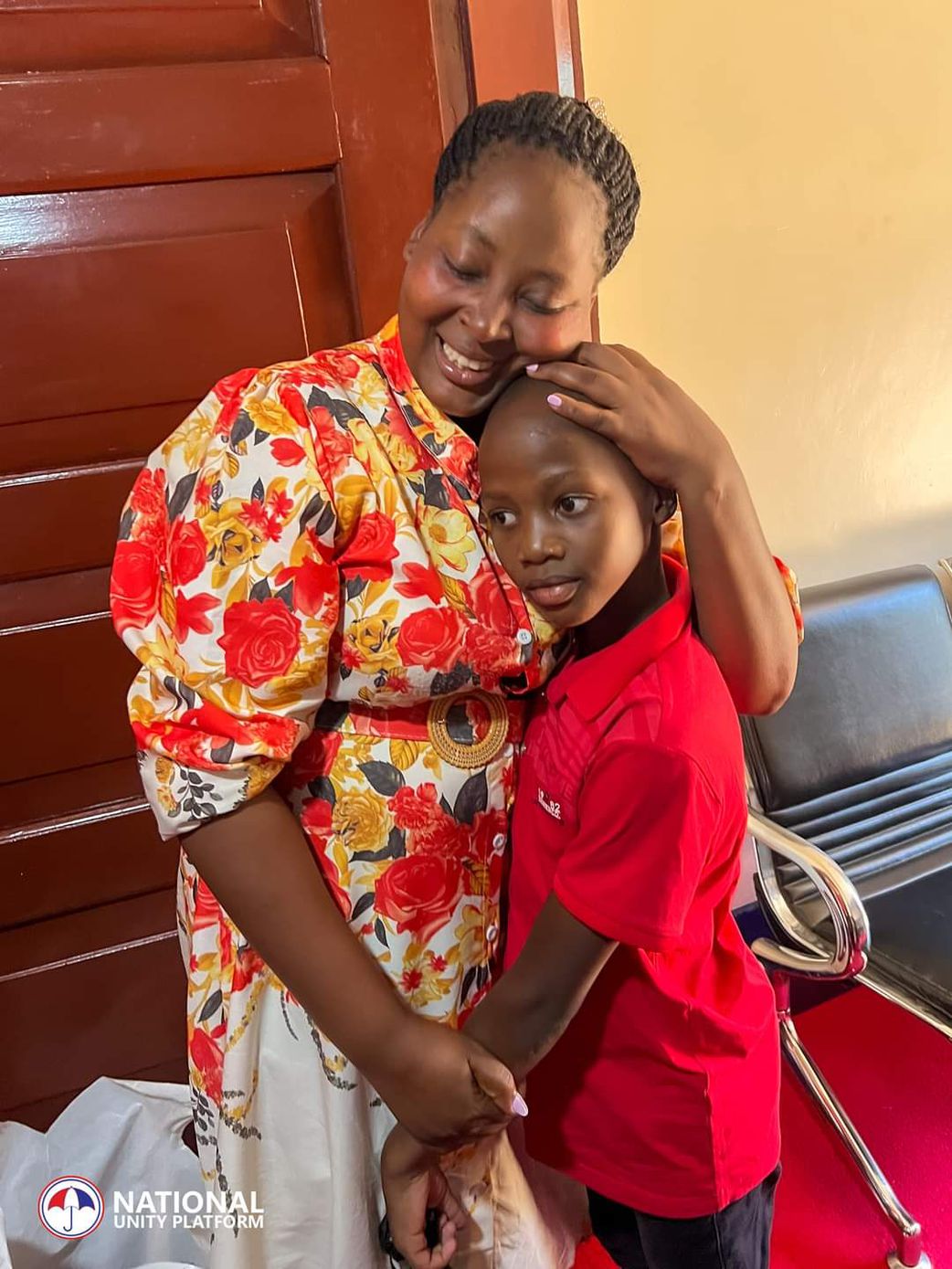 Olivia Lutaaya hugs her son