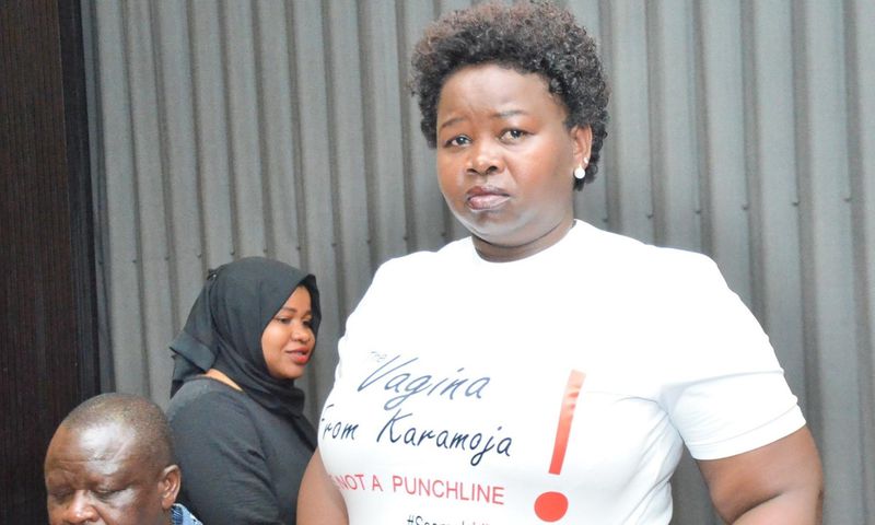 MP Faith Nakut protesting in a t-shirt