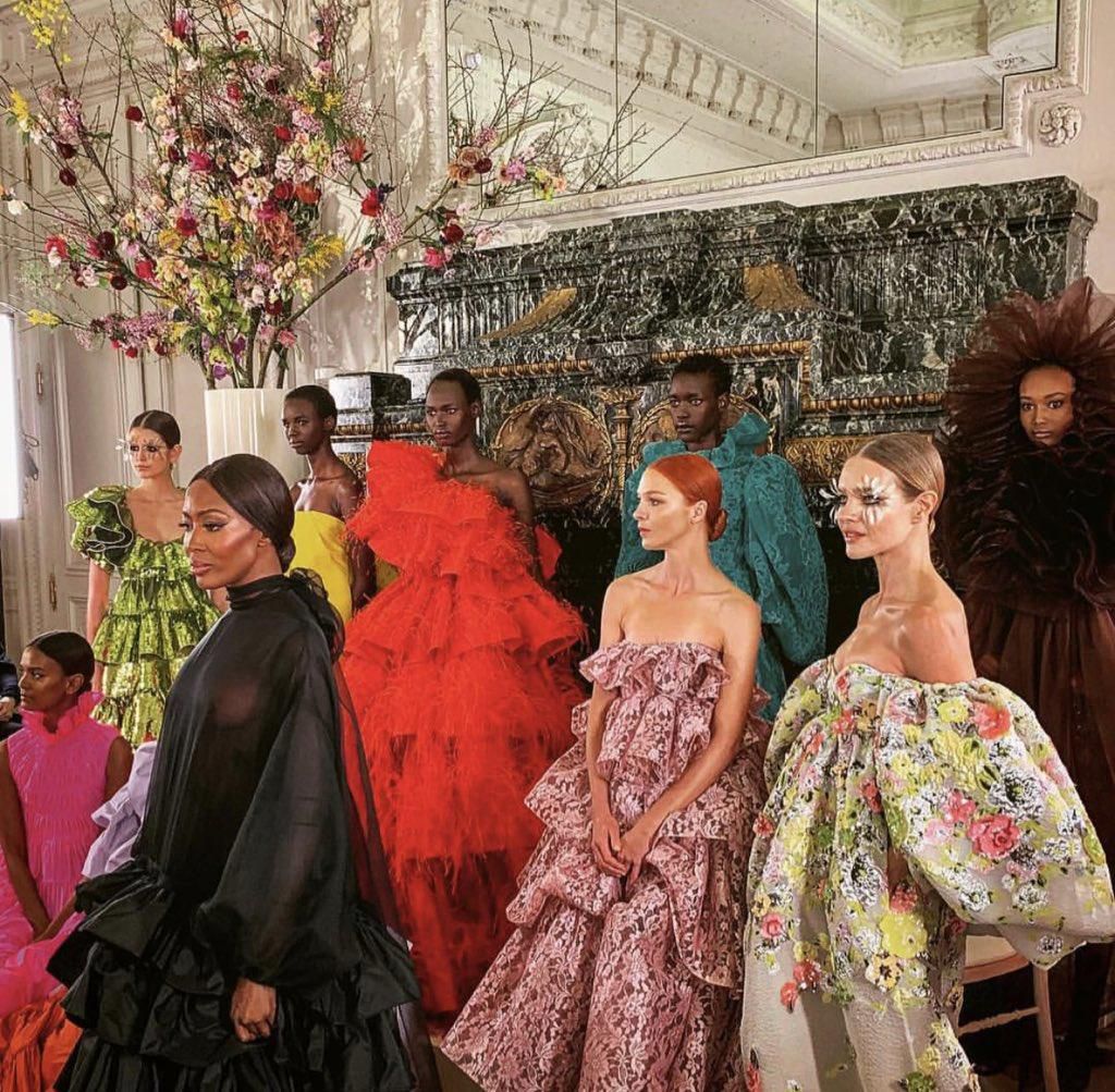 Ugandan model Ayak Veronica, 18, walks the runway during Valentino Couture Show alongside Naomi Campbell