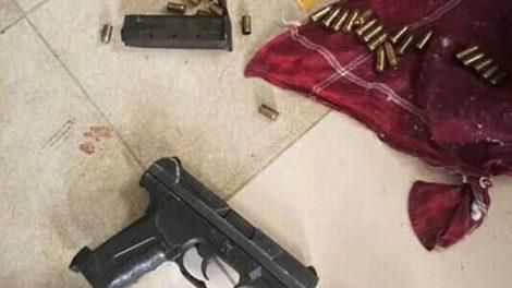 File image of a firearm and ammunition recovered recovered by the police from a suspected gangster who was shot dead in Kariobangi South, Nairobi