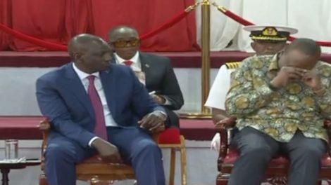 President Uhuru Kenyatta laughing as DP William Ruto watches
