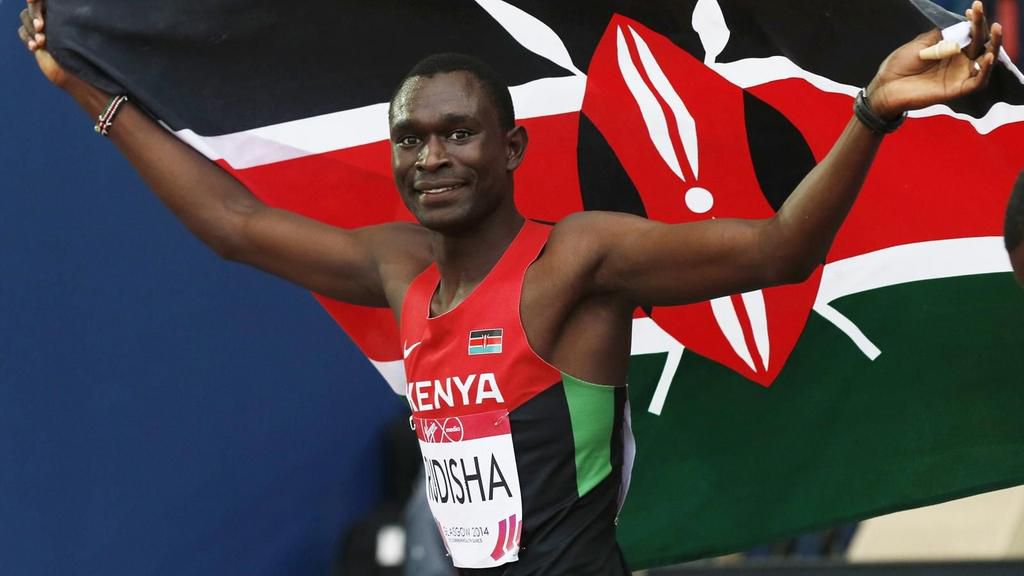 Kenyan athlete David Rudisha with Kenyan flag