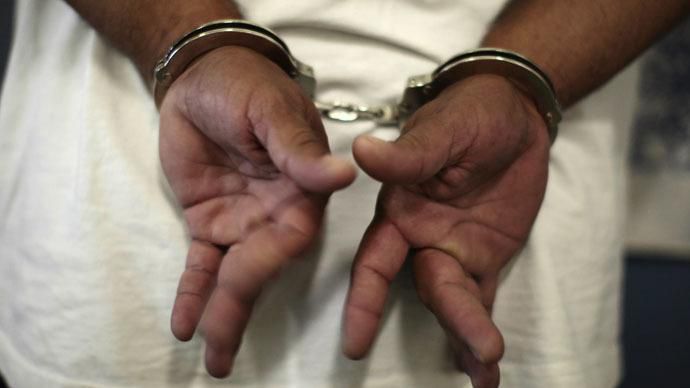 A woman in handcuffs