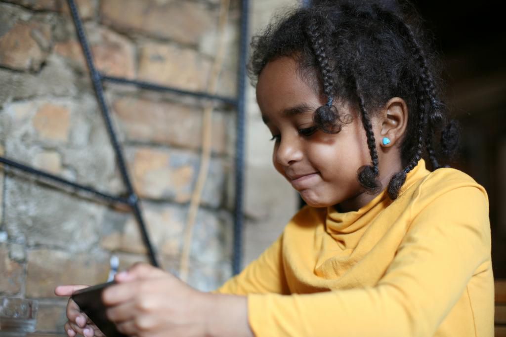 Child on her phone (Courtesy)