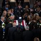 Hillary Clinton Urges Defense of Democracy at Cummings' Funeral