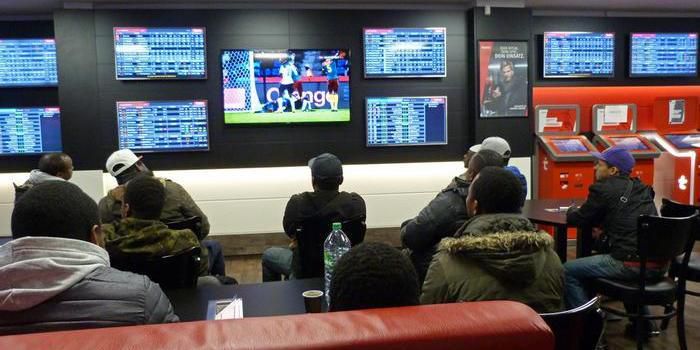 Gamblers in a betting shop in Kenya