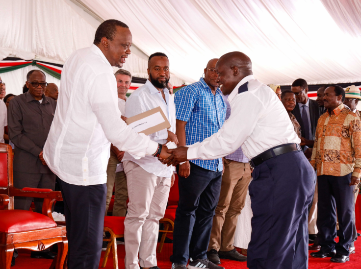 President Uhuru Kenyatta congratulates one of 136 Kenyans who have gained employment as seafarers on several ships owned by the Mediterranean Shipping Company (MSC). (courtesy)
