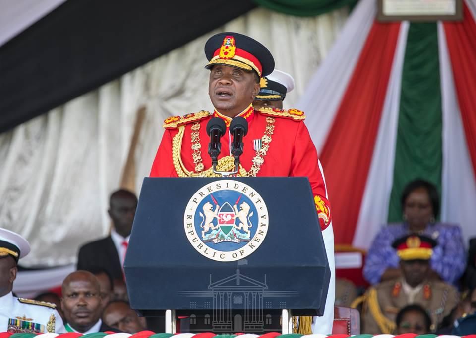Uhuru dons a red Commander-in-Chief’s ceremonial military uniform (Courtesy)