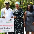 Uganda's Tourism Minister Godfrey Kiwanda posed with women during the launch of the Miss Curvy beauty contest in the capital Kampala