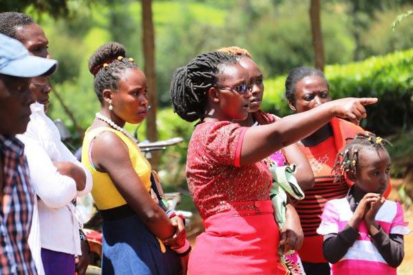 Members of the public at the scene where a house fire wiped out a family of four on Sunday, April 21, 2019