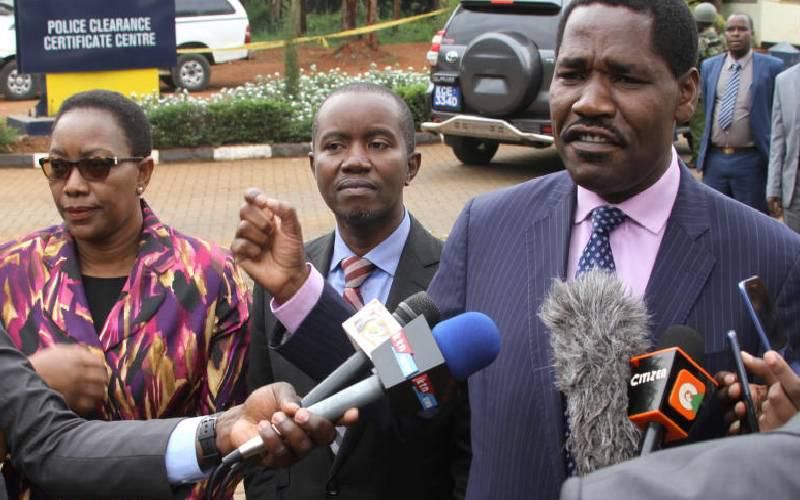 Cabinet Secretaries Sicily Kariuki (Health) Joe Mucheru (ICT) and Peter Munya (Industrialization) address a press conference outside DCI offices