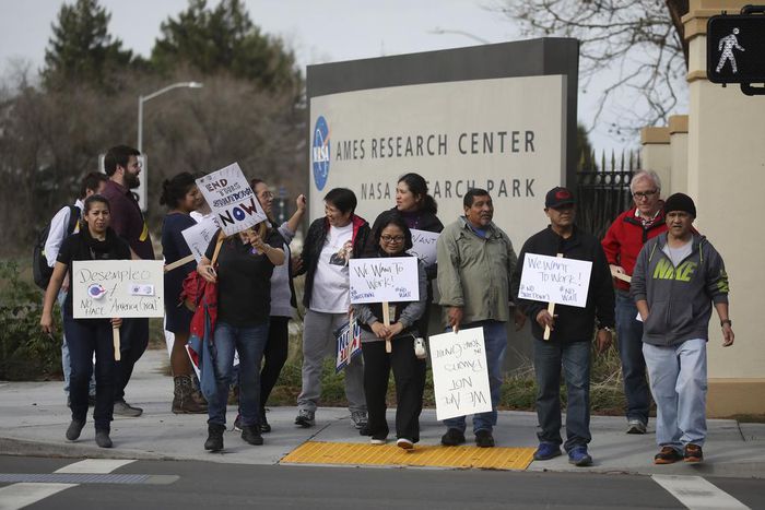 They Build Spacecraft and Fight Epidemics for America. The Shutdown May Scare Them Away.