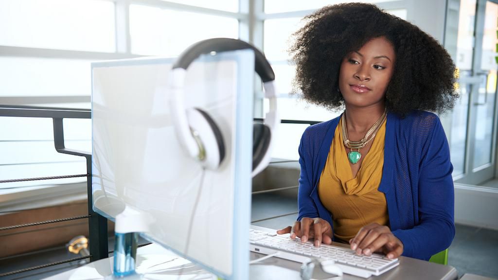 Woman working in office(MadameNoire)