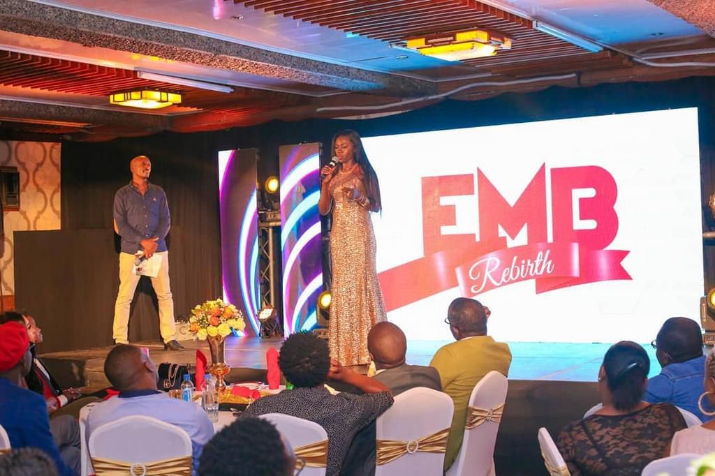 Celebrities at the EMB Rebirth Party . Bahati signs Dany Gift