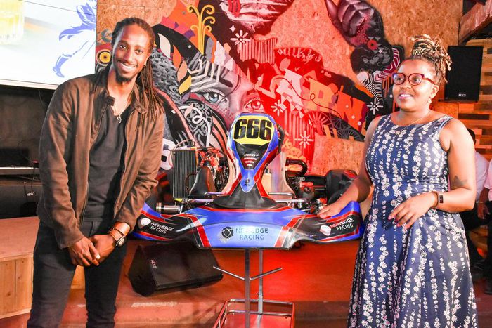 JBLESSING (RACER) WITH KBL HEAD OF SPIRITS GRACE NSHEMEIRE GWAKU DURING THE LAUNCH OF JOHNNIE WALKER FORMULA 1 VR & GP KARTING CHAMPIONSHIPS LAUNCH IN NAIROBI (1)