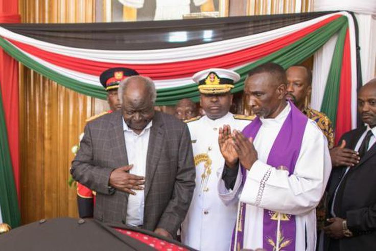 Retired President Mwai Kibaki viewing the body of predecessor, former President Daniel Arap Moi on Saturday, February 9