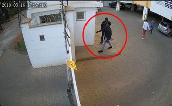Man hunt for foreigner captured on video threatening to shoot security guard