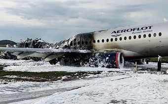 Why do you grab your bag when running off a burning plane