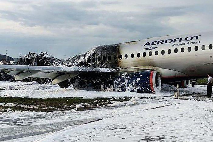 Why do you grab your bag when running off a burning plane