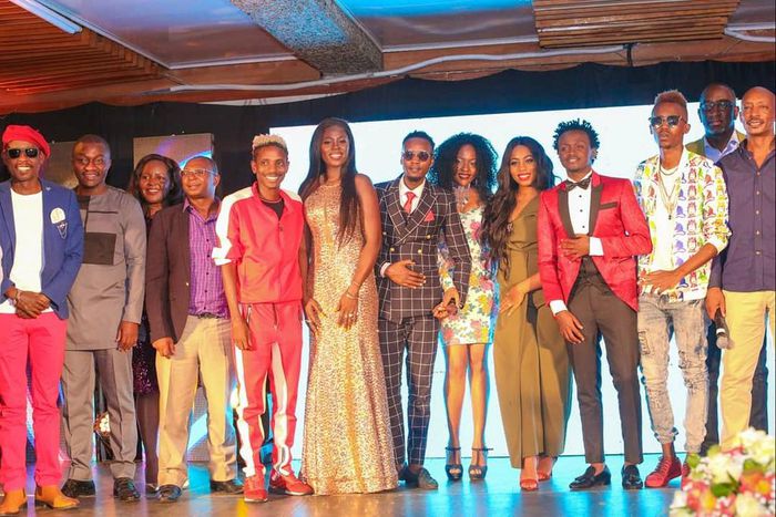 Celebrities at the EMB Rebirth Party . Bahati signs Dany Gift