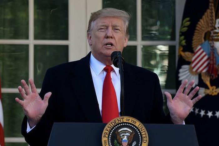 Government reopens as Trump casts doubt on prospects for a border wall deal