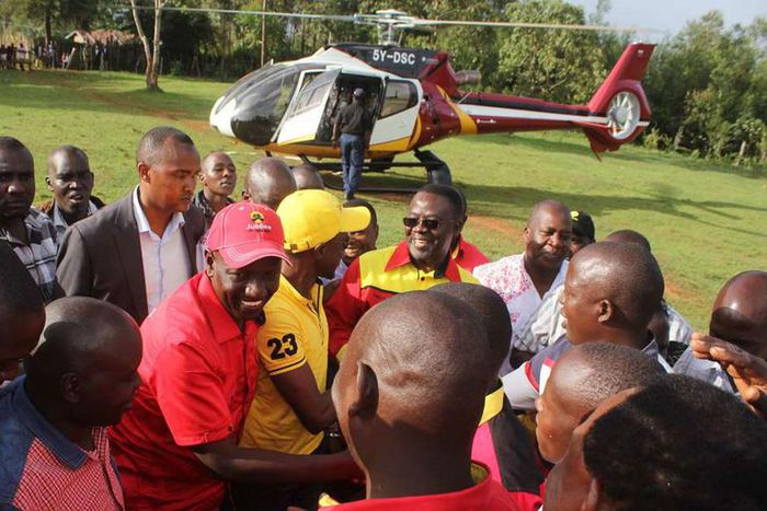 File image of Deputy President William Ruto (centre), and Labour Party of Kenya Leader Ababu Namwamba after alighting from a chopper