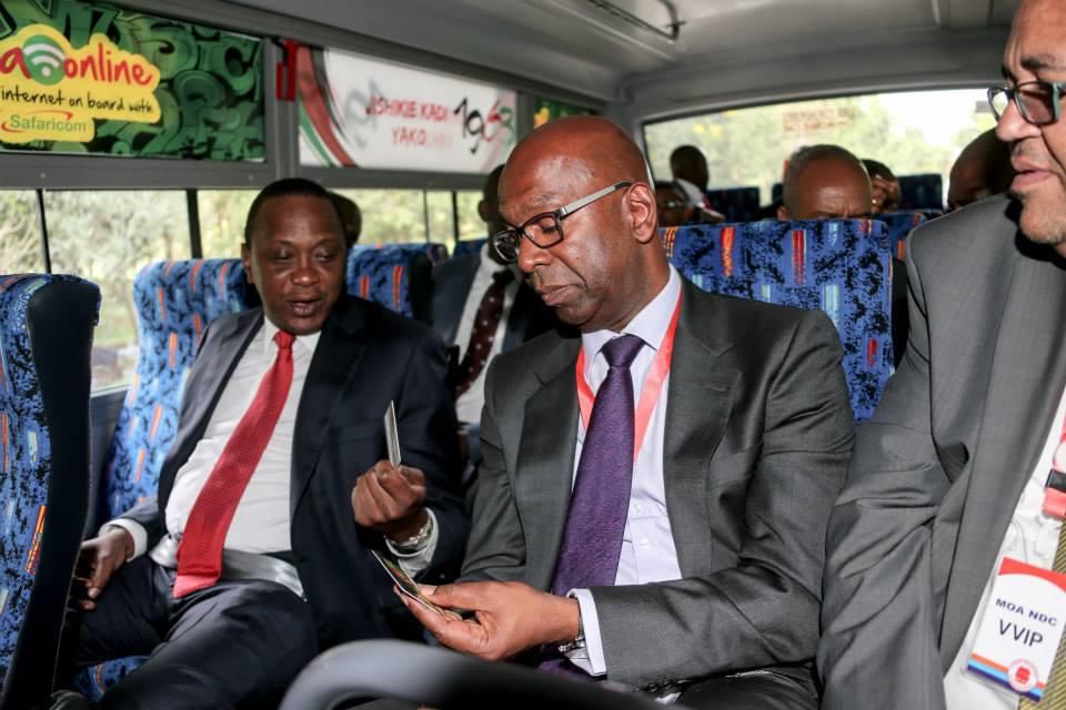 Uhuru Kenyatta and the late Bob Collymore ride a Matatu