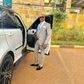 File image of controversial politician Steve Mbogo standing next to one of the high-end vehicles in his fleet DCI has impounded one of his Range Rovers